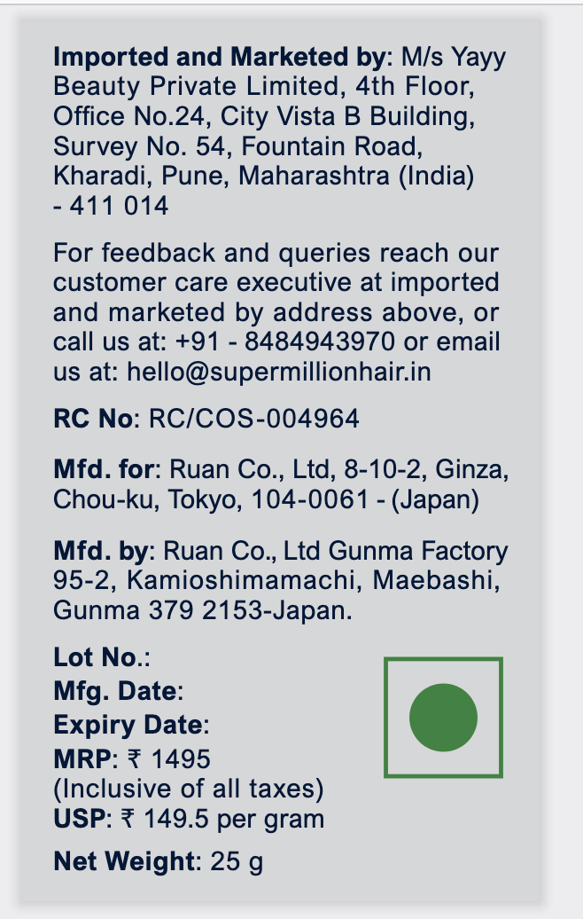 Close-up of the India label on a 25 g Super Million Hair pack showing the importer Yayy Beauty Private Limited, RC No RC/COS-004964, manufacturer Ruan Co. Ltd Gunma Factory, MRP inclusive of all taxes and price per gram
